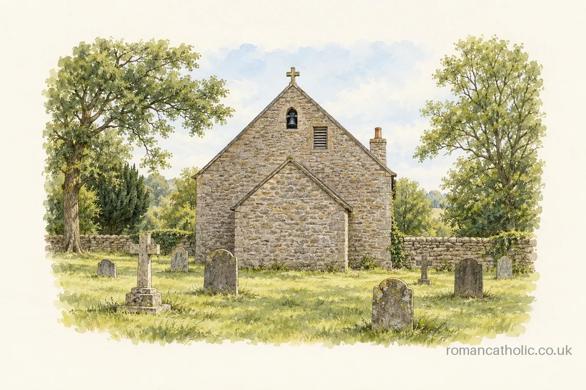 Stone chapel with small bell niche and plain porch seen across a grassy graveyard.